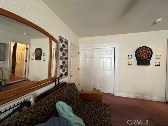 3854 Canvasback Ct, Merced, CA 95340 - carpeted living area featuring baseboards