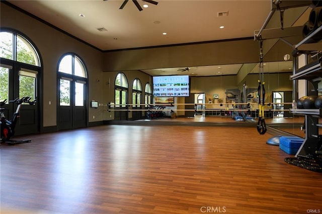11937 Wandering Way, Corona, CA 92883 - workout area featuring a ceiling fan, wood finished floors, ornamental molding, and a high ceiling