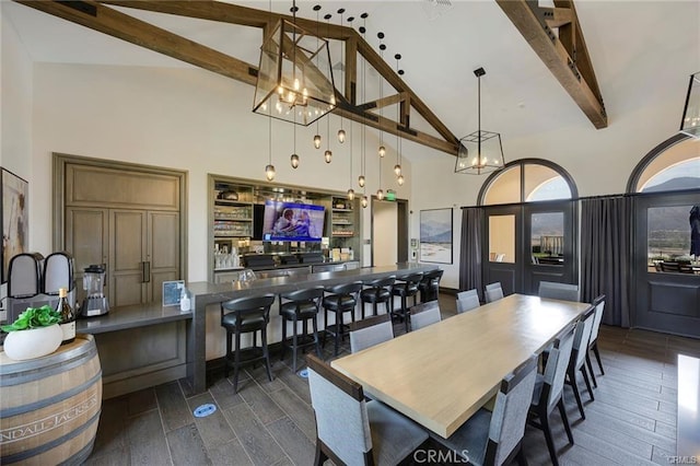 11937 Wandering Way, Corona, CA 92883 - dining area featuring high vaulted ceiling, beamed ceiling, a chandelier, and dark wood-style flooring