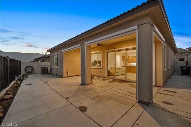 11937 Wandering Way, Corona, CA 92883 - back of house with stucco siding, a fenced backyard, a patio, a tile roof, and a mountain view