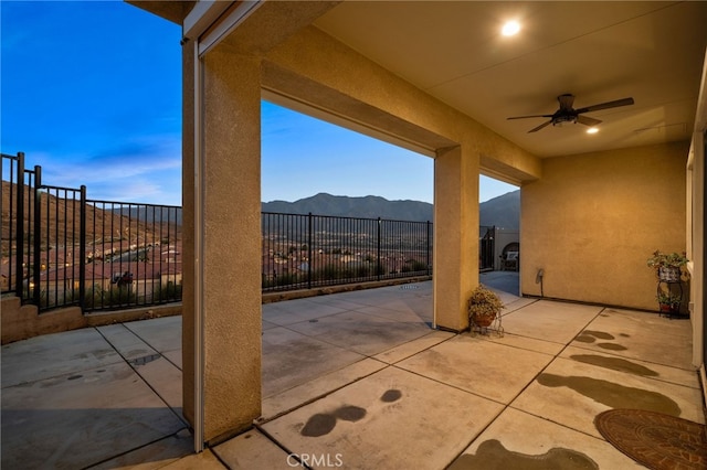 11937 Wandering Way, Corona, CA 92883 - view of patio / terrace with a ceiling fan and a mountain view