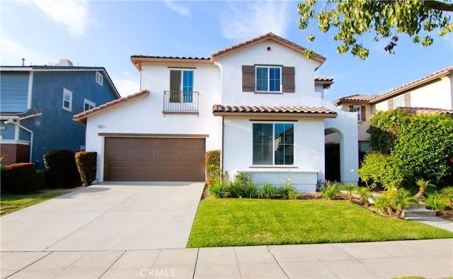629 E Gardenia Dr, Azusa, CA 91702 - mediterranean / spanish-style home with a tile roof, stucco siding, a balcony, driveway, and a front lawn