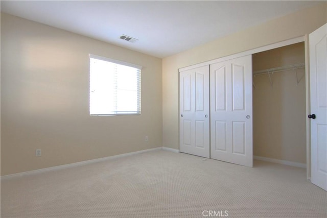 629 E Gardenia Dr, Azusa, CA 91702 - unfurnished bedroom with a closet and light carpet
