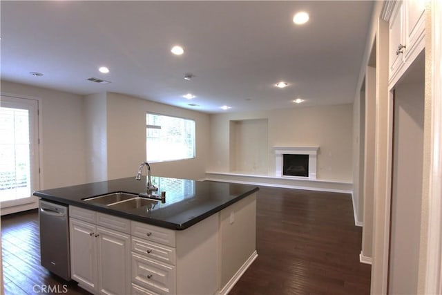 629 E Gardenia Dr, Azusa, CA 91702 - kitchen featuring dishwasher, dark wood-style flooring, white cabinets, dark countertops, and a kitchen island with sink