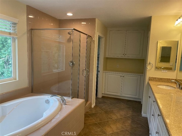 629 E Gardenia Dr, Azusa, CA 91702 - bathroom featuring vanity, a garden tub, a shower stall, and tile patterned floors