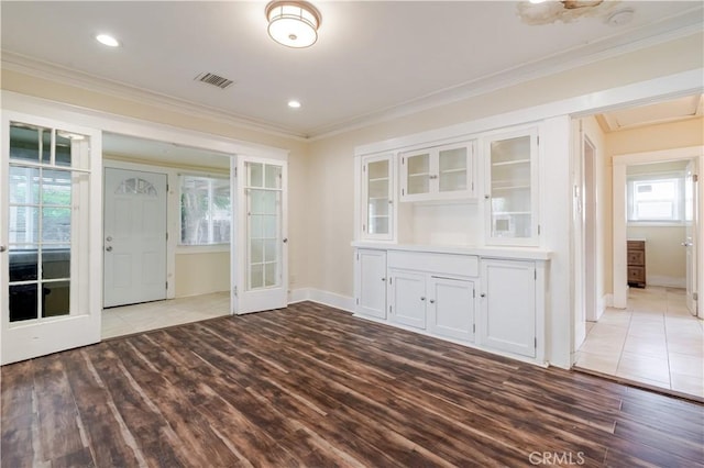 903 W 84th St, Los Angeles, CA 90044 - unfurnished dining area featuring wood finished floors, crown molding, and recessed lighting