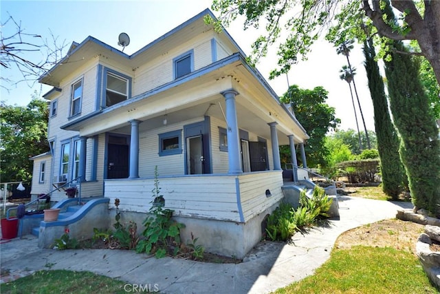 724 W 2nd St, Pomona, CA 91766 - victorian home with a porch