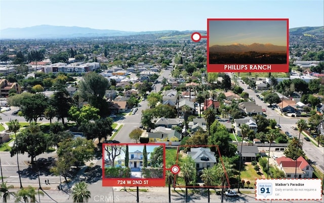 724 W 2nd St, Pomona, CA 91766 - aerial view of residential area with property parcel outlined and a mountainous background