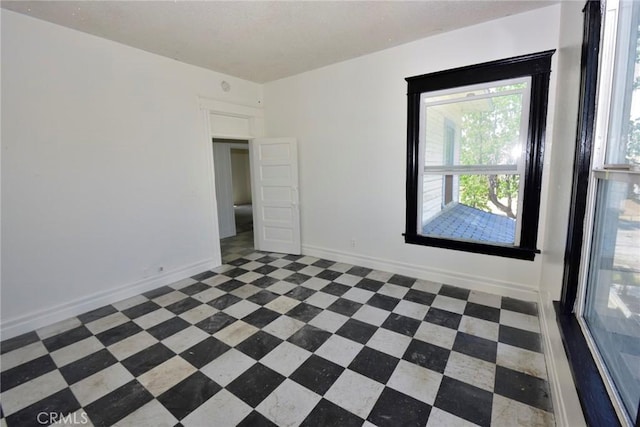 724 W 2nd St, Pomona, CA 91766 - spare room featuring baseboards and light flooring