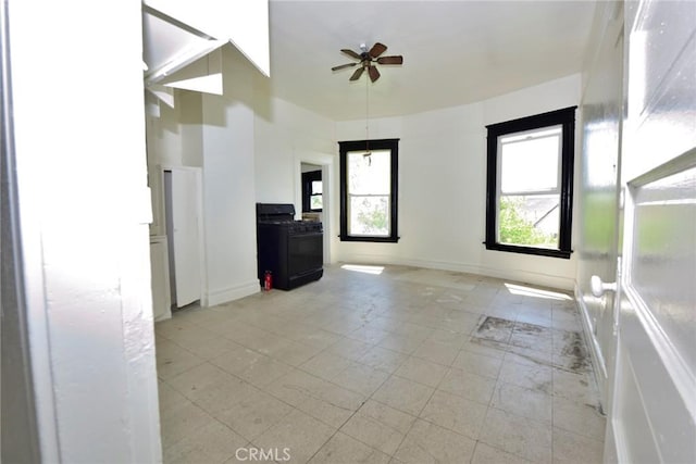 724 W 2nd St, Pomona, CA 91766 - unfurnished living room featuring ceiling fan and baseboards