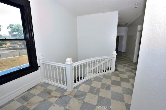 724 W 2nd St, Pomona, CA 91766 - hallway with an upstairs landing, healthy amount of natural light, and tile patterned floors