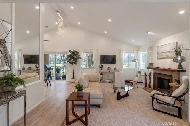 3246 Little Mountain Dr Unit D, San Bernardino, CA 92405 - living room with high vaulted ceiling, a fireplace with raised hearth, recessed lighting, wood finished floors, and beamed ceiling