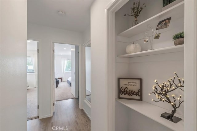 3246 Little Mountain Dr Unit D, San Bernardino, CA 92405 - corridor with wood finished floors and a chandelier