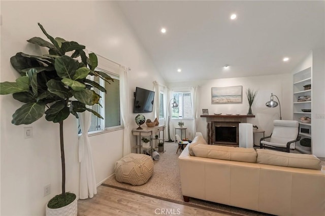 3246 Little Mountain Dr Unit D, San Bernardino, CA 92405 - living room featuring wood finished floors, a fireplace, recessed lighting, and vaulted ceiling