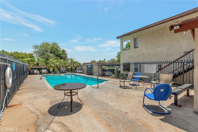 3246 Little Mountain Dr Unit D, San Bernardino, CA 92405 - community pool with a patio and stairway