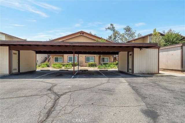 3246 Little Mountain Dr Unit D, San Bernardino, CA 92405 - view of building exterior featuring stairway and covered parking