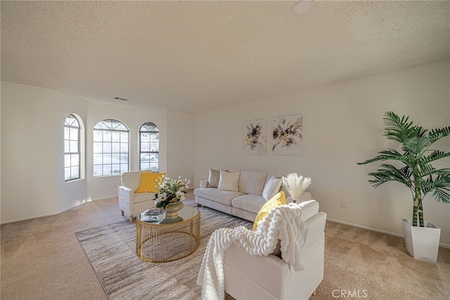 44118 Ruthron Ave, Lancaster, CA 93536 - living room featuring light colored carpet and a textured ceiling