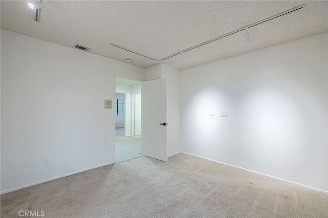 44118 Ruthron Ave, Lancaster, CA 93536 - spare room featuring light colored carpet and a textured ceiling