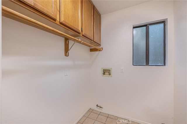 44118 Ruthron Ave, Lancaster, CA 93536 - washroom featuring cabinet space, light tile patterned floors, and washer hookup