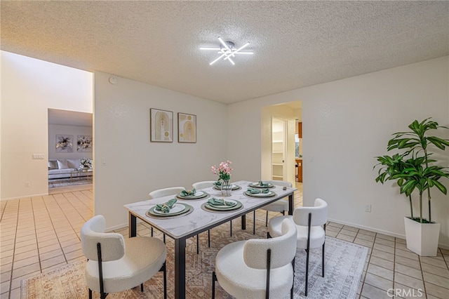 44118 Ruthron Ave, Lancaster, CA 93536 - dining space with light tile patterned floors and a textured ceiling