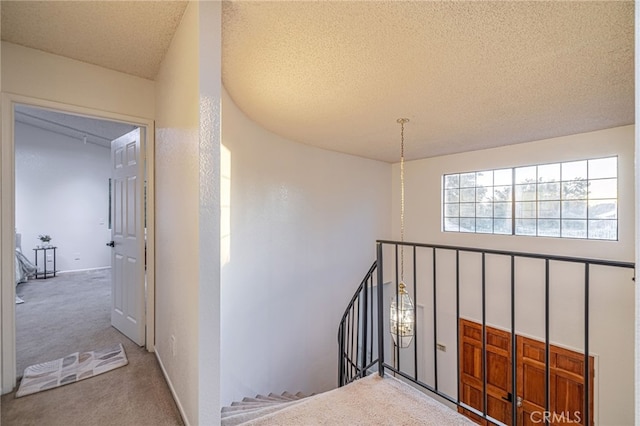 44118 Ruthron Ave, Lancaster, CA 93536 - corridor featuring carpet, an upstairs landing, and a textured ceiling