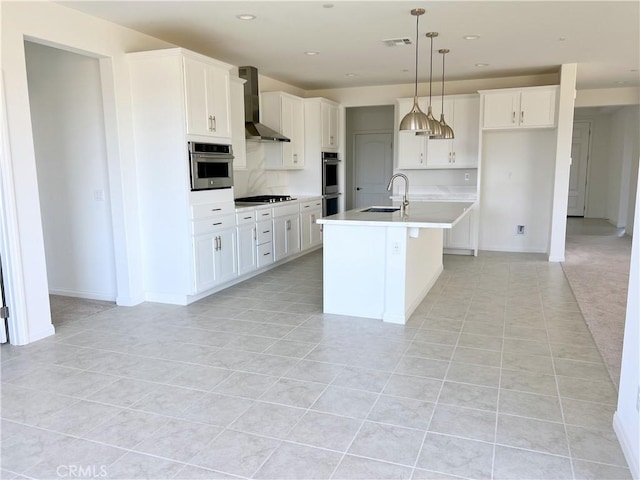 17727 Santa Lucia Ct, Riverside, CA 92503 - kitchen with wall chimney exhaust hood, double oven, gas cooktop, light tile patterned flooring, and white cabinets