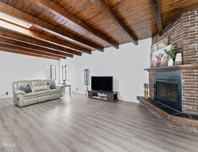 1904 N 7th St, Port Hueneme, CA 93041 - living room featuring wood finished floors, a fireplace, and a wood ceiling with exposed beams