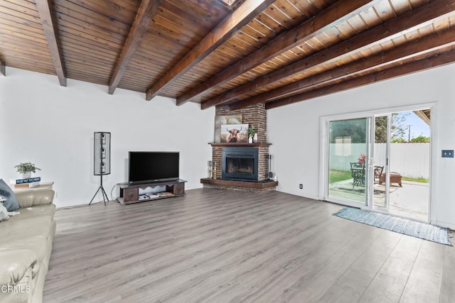 1904 N 7th St, Port Hueneme, CA 93041 - unfurnished living room featuring wood finished floors, a wood ceiling with exposed beams, and a fireplace