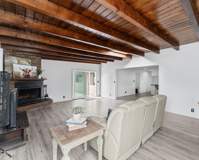 1904 N 7th St, Port Hueneme, CA 93041 - living area featuring wood finished floors, a fireplace with raised hearth, and a wood ceiling with exposed beams