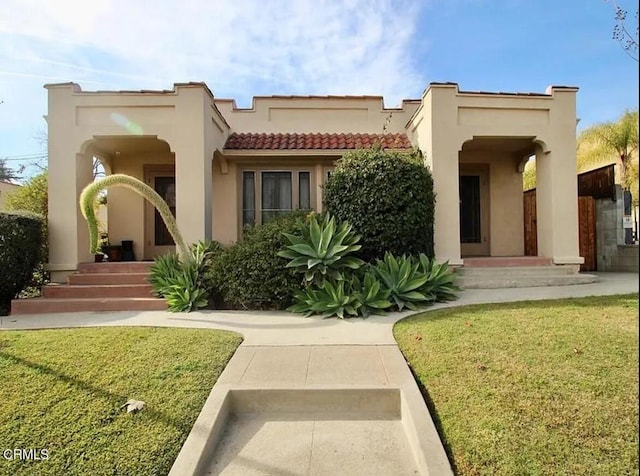 1165 N Lake Ave, Pasadena, CA 91104 - view of front of property with a tile roof, a front yard, and stucco siding
