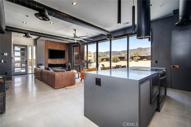 6640 Mount Shasta Ave, Joshua Tree, CA 92252 - living room with finished concrete floors and ceiling fan