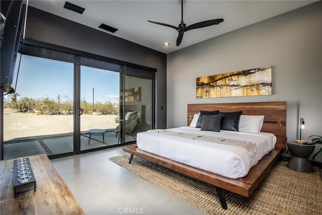 6640 Mount Shasta Ave, Joshua Tree, CA 92252 - bedroom featuring access to exterior, concrete flooring, and ceiling fan