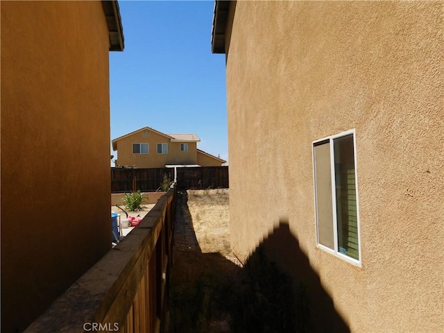 12405 Firefly Way, Victorville, CA 92392 - view of side of property featuring stucco siding and a balcony