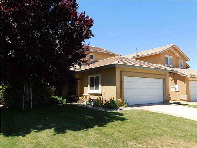 12405 Firefly Way, Victorville, CA 92392 - view of front of house with concrete driveway, stucco siding, a front lawn, and a garage