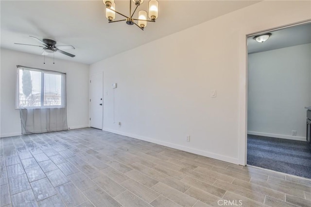 1964 E 114th St, Los Angeles, CA 90059 - unfurnished room with ceiling fan, a chandelier, and wood finish floors