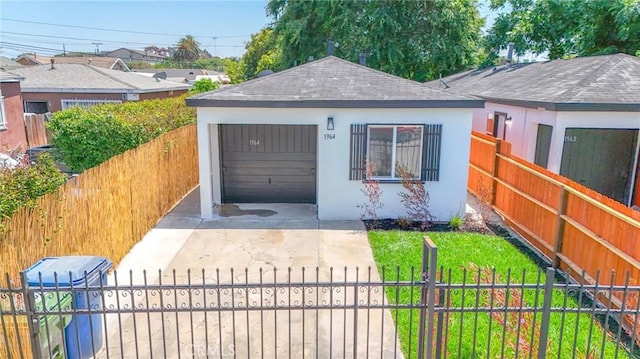 1964 E 114th St, Los Angeles, CA 90059 - view of front of house with driveway, a fenced front yard, stucco siding, and roof with shingles