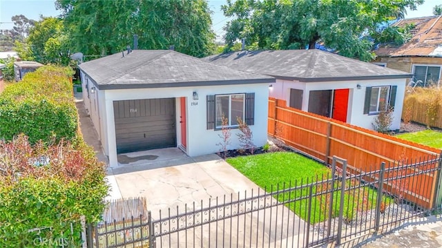 1964 E 114th St, Los Angeles, CA 90059 - view of front of property with a fenced front yard, concrete driveway, and a garage