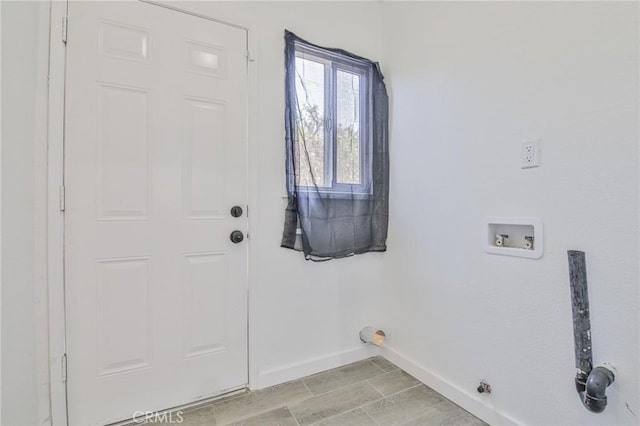 1964 E 114th St, Los Angeles, CA 90059 - laundry area featuring baseboards and washer hookup