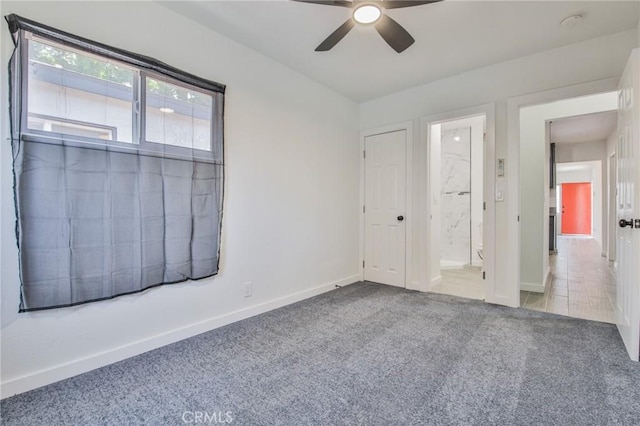 1964 E 114th St, Los Angeles, CA 90059 - unfurnished bedroom with carpet, connected bathroom, and ceiling fan