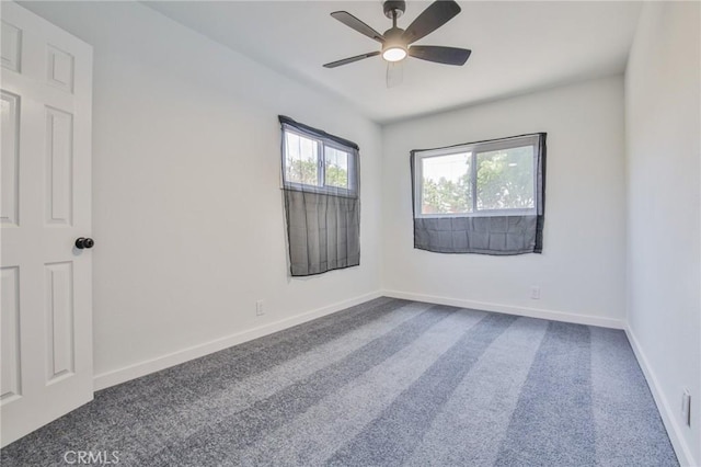1964 E 114th St, Los Angeles, CA 90059 - unfurnished room with dark colored carpet and ceiling fan