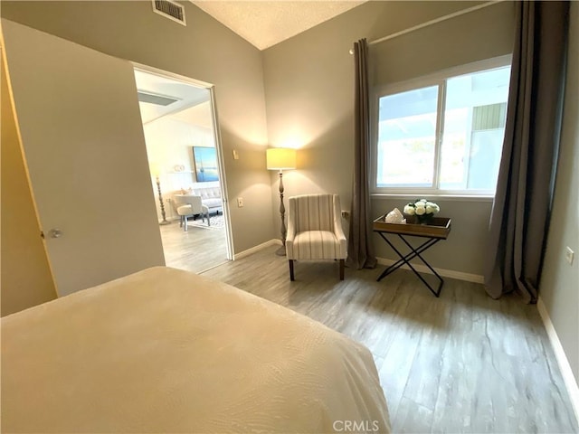 1441 Monterey Rd Unit M2-61J, Seal Beach, CA 90740 - bedroom with wood finished floors and lofted ceiling