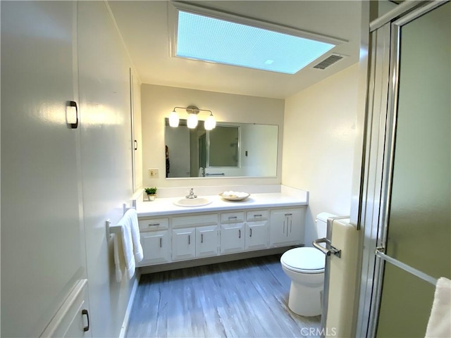 1441 Monterey Rd Unit M2-61J, Seal Beach, CA 90740 - full bathroom with vanity, wood finished floors, and a shower with door