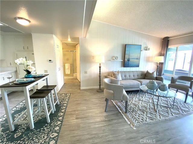 1441 Monterey Rd Unit M2-61J, Seal Beach, CA 90740 - living room featuring wood finished floors and a textured ceiling