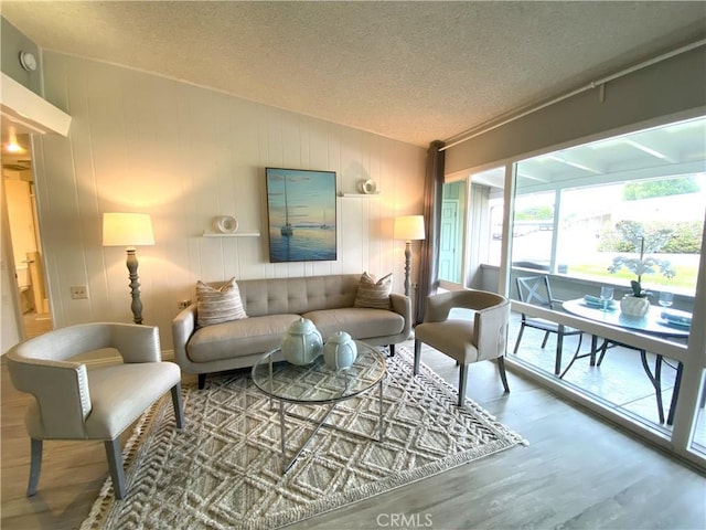 1441 Monterey Rd Unit M2-61J, Seal Beach, CA 90740 - living area with wood finished floors and a textured ceiling