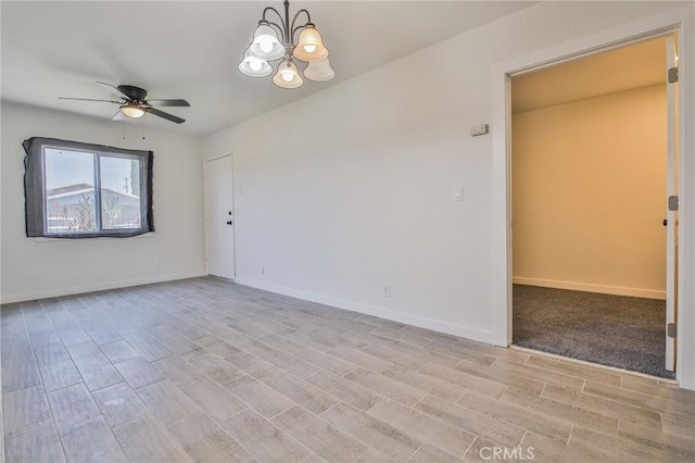 1962 E 114th St, Los Angeles, CA 90059 - spare room featuring wood finish floors, a ceiling fan, and a chandelier