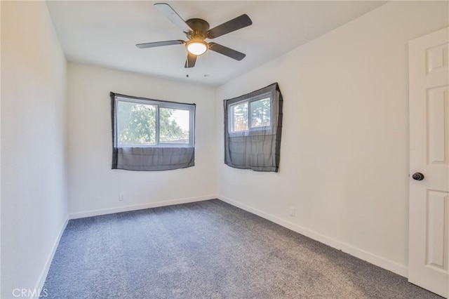 1962 E 114th St, Los Angeles, CA 90059 - spare room featuring dark carpet and a ceiling fan