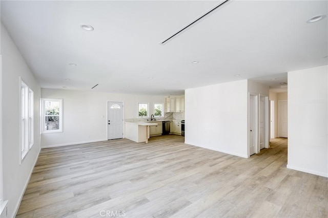 1038 N Columbus Ave, Glendale, CA 91202 - unfurnished living room featuring light wood-type flooring and recessed lighting