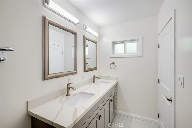 1038 N Columbus Ave, Glendale, CA 91202 - bathroom featuring double vanity and baseboards
