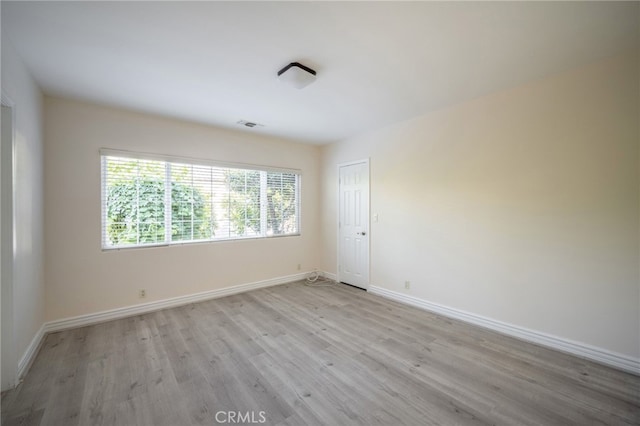 1038 N Columbus Ave, Glendale, CA 91202 - spare room featuring light wood-style flooring and baseboards