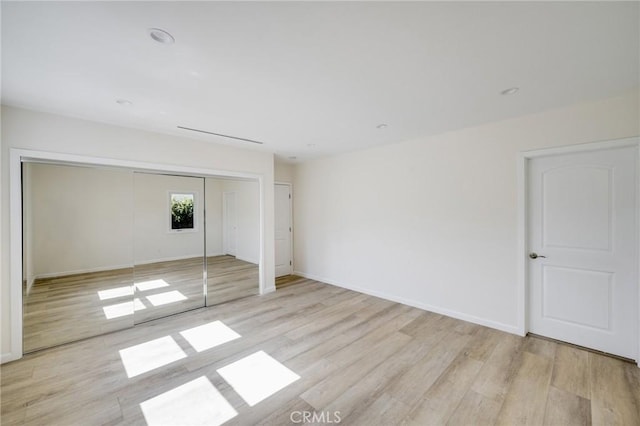 1038 N Columbus Ave, Glendale, CA 91202 - unfurnished bedroom with wood finished floors and a closet